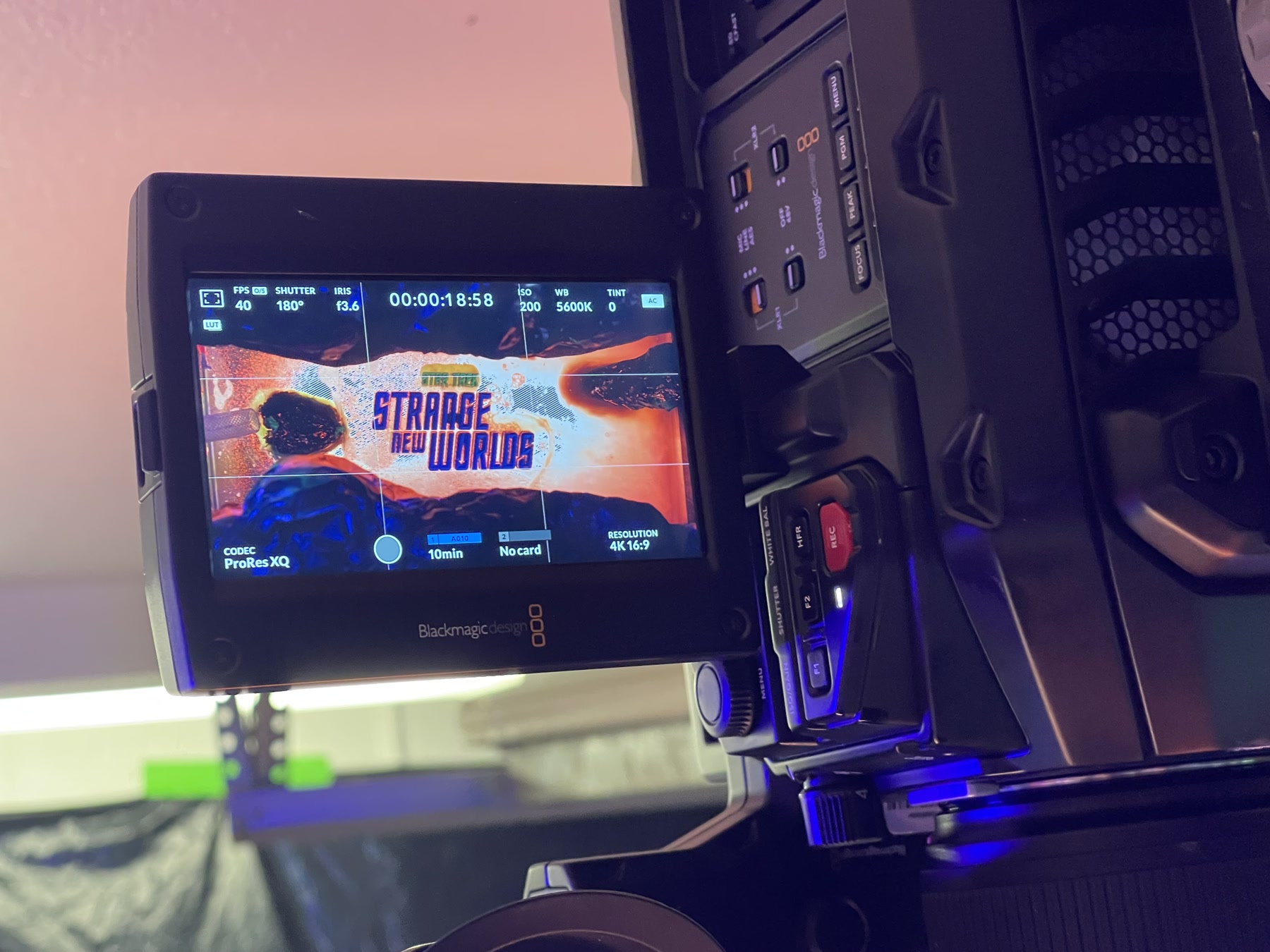 Camera monitor framing the practical ooze river around the title treatment.