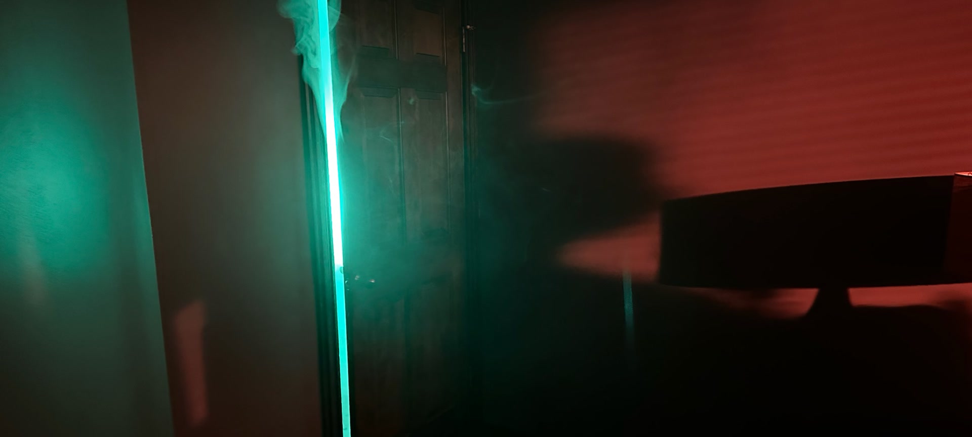 The practical doorway setup filled with haze and concealed green light before the portal effect was finished.